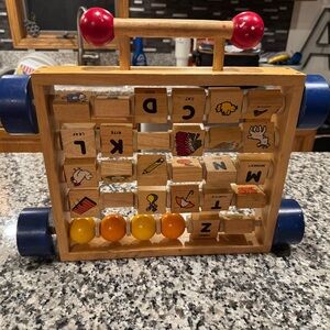Wooden Alphabet Activity Toy with Red and Blue Accents